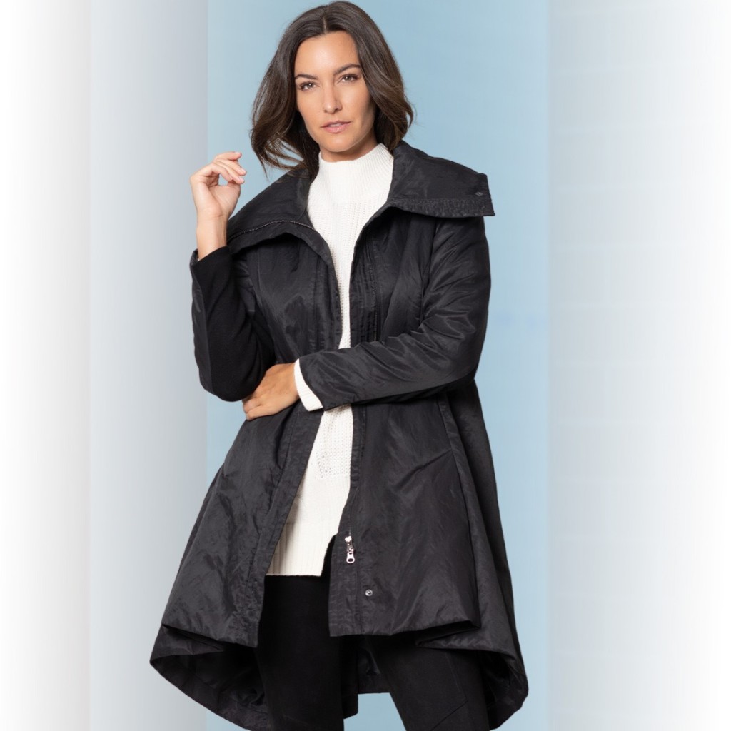 The girl is wearing  a black coat as one of the gifting ideas for women